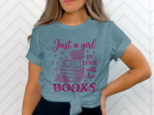 Teal t-shirt with pink text reading "Just a girl IN LOVE with her BOOKS".
