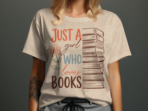 Light gray t-shirt with text "JUST A girl WHO loves BOOKS" and stacked books.