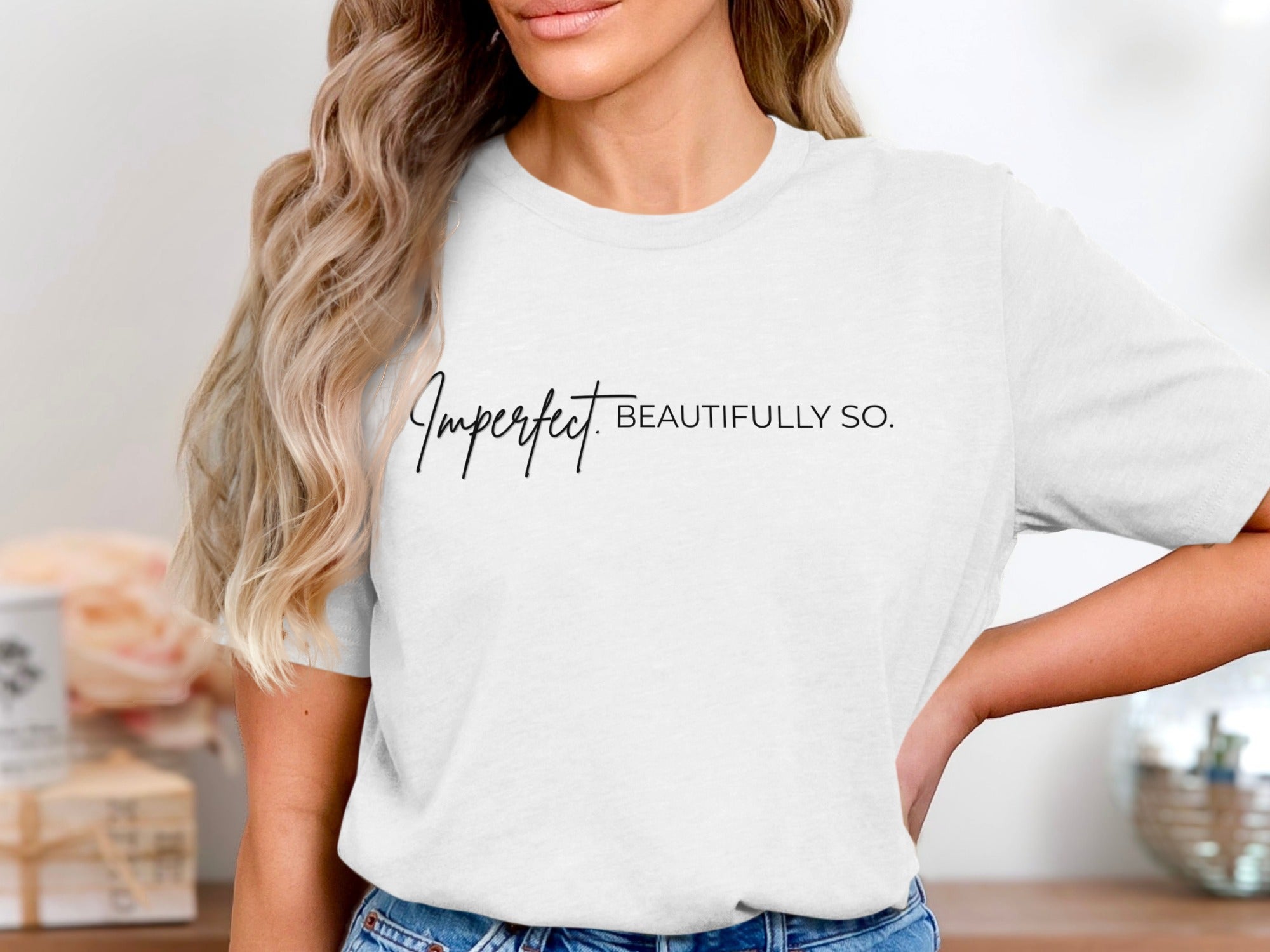 White t-shirt with black text "Imperfect BEAUTIFULLY SO."