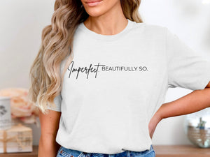White t-shirt with black text "Imperfect BEAUTIFULLY SO."