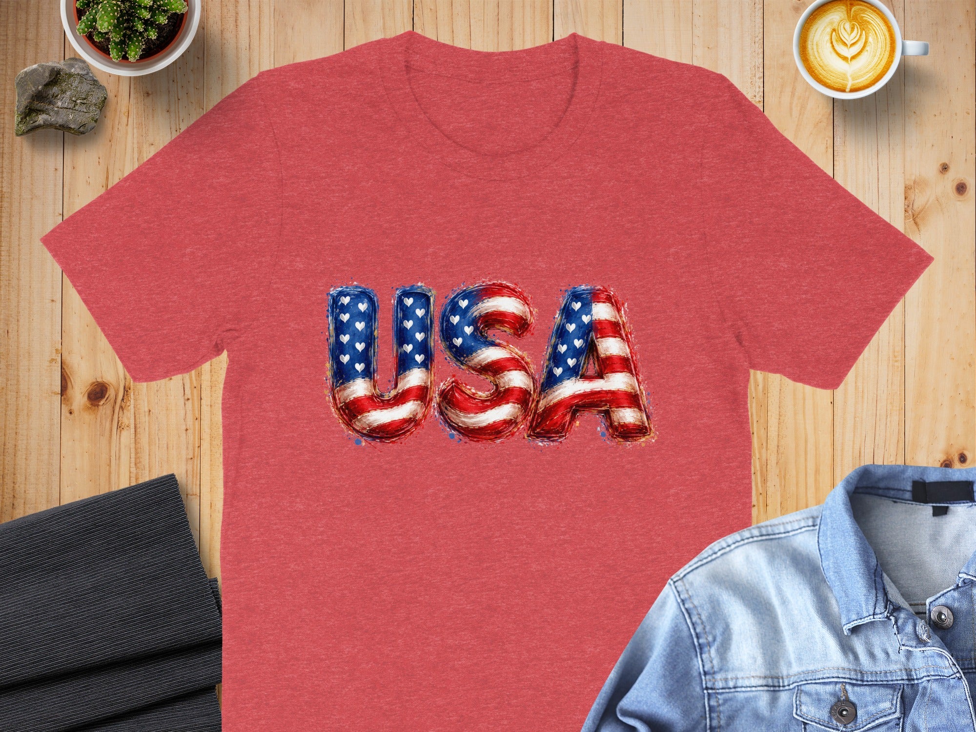 Red t-shirt with "USA" text in American flag design.