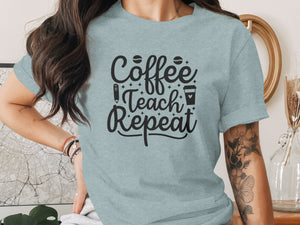 Light blue t-shirt with black text reading "Coffee Teach Repeat" and icons.