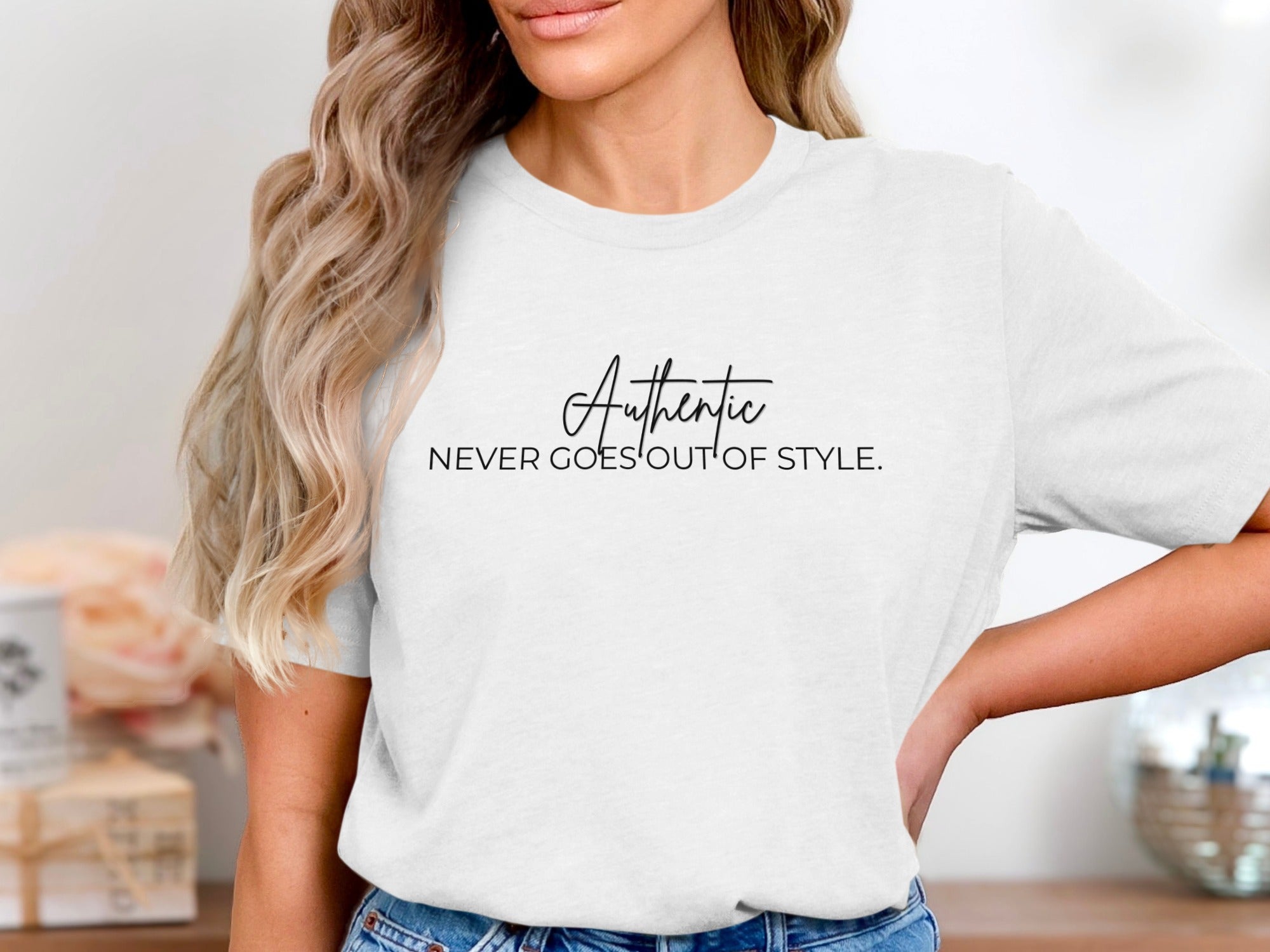 White t-shirt with black text reading "Authentic NEVER GOES OUT OF STYLE."