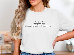 White t-shirt with black text reading "Authentic NEVER GOES OUT OF STYLE."