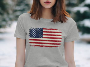 Grey t-shirt with distressed American flag graphic on front.