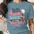 Blue t-shirt with "I'm Not Always A Train Wreck Just Kidding Toot Toot" text and train graphic.
