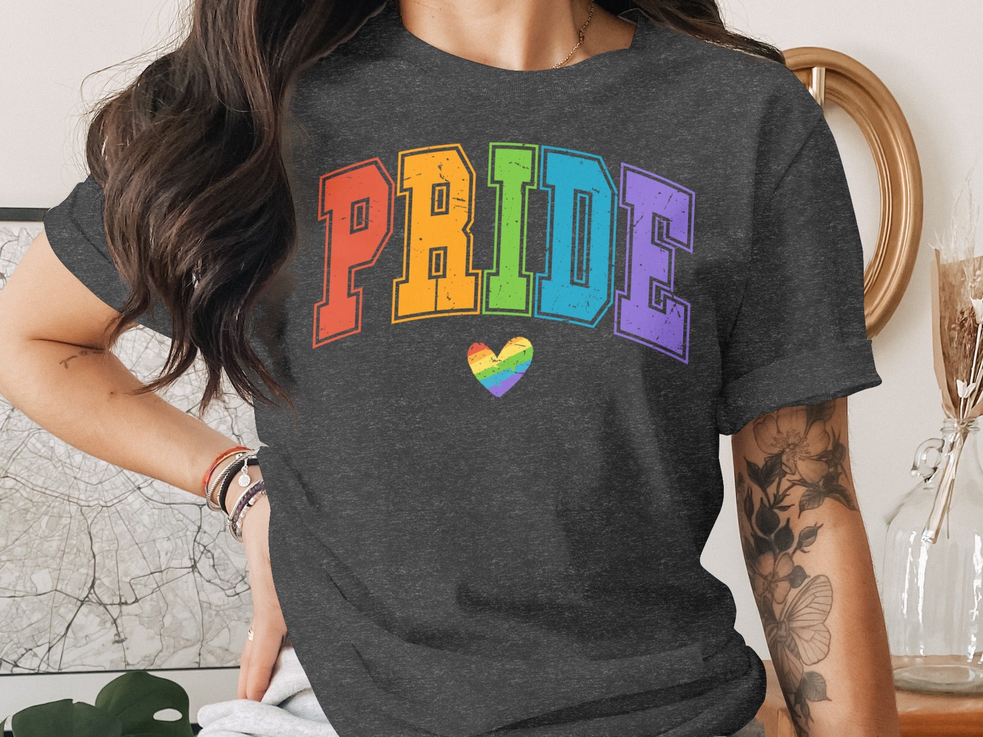 Dark grey t-shirt with rainbow "PRIDE" text and a rainbow heart.
