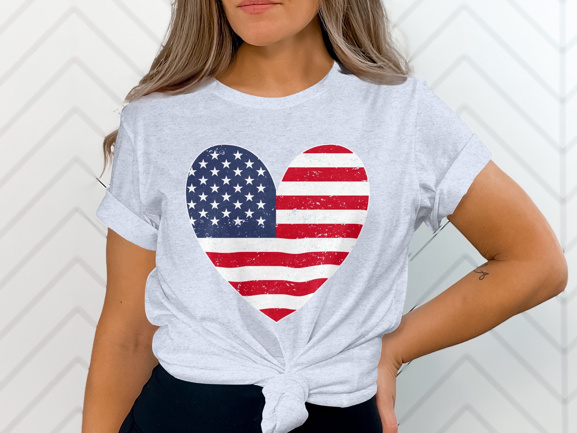 Light grey t-shirt with a distressed American flag heart graphic.