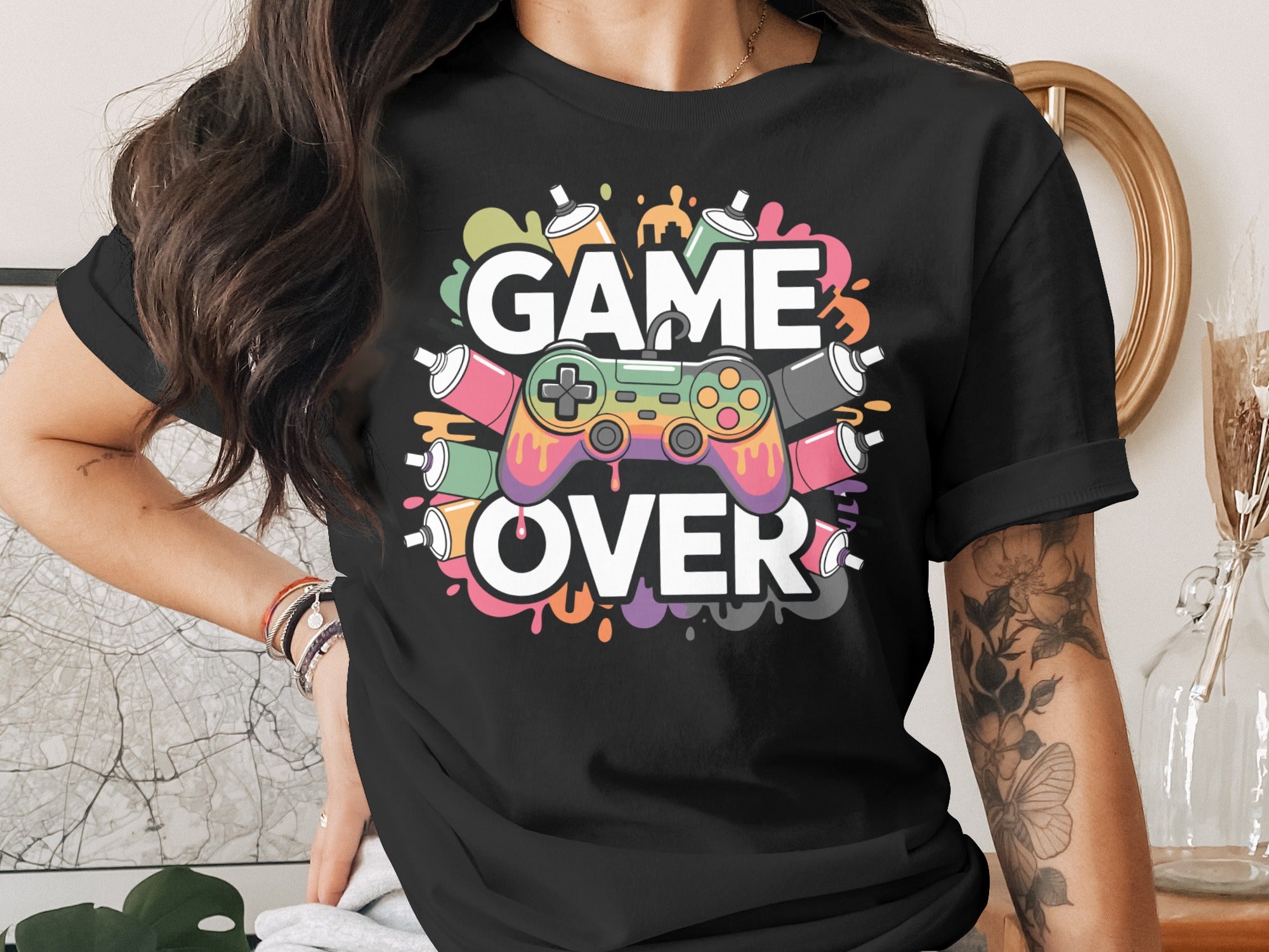 Black t-shirt with colorful "GAME OVER" text and controller graphic.