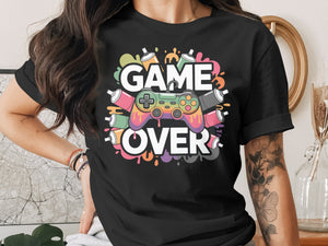 Black t-shirt with colorful "GAME OVER" text and controller graphic.
