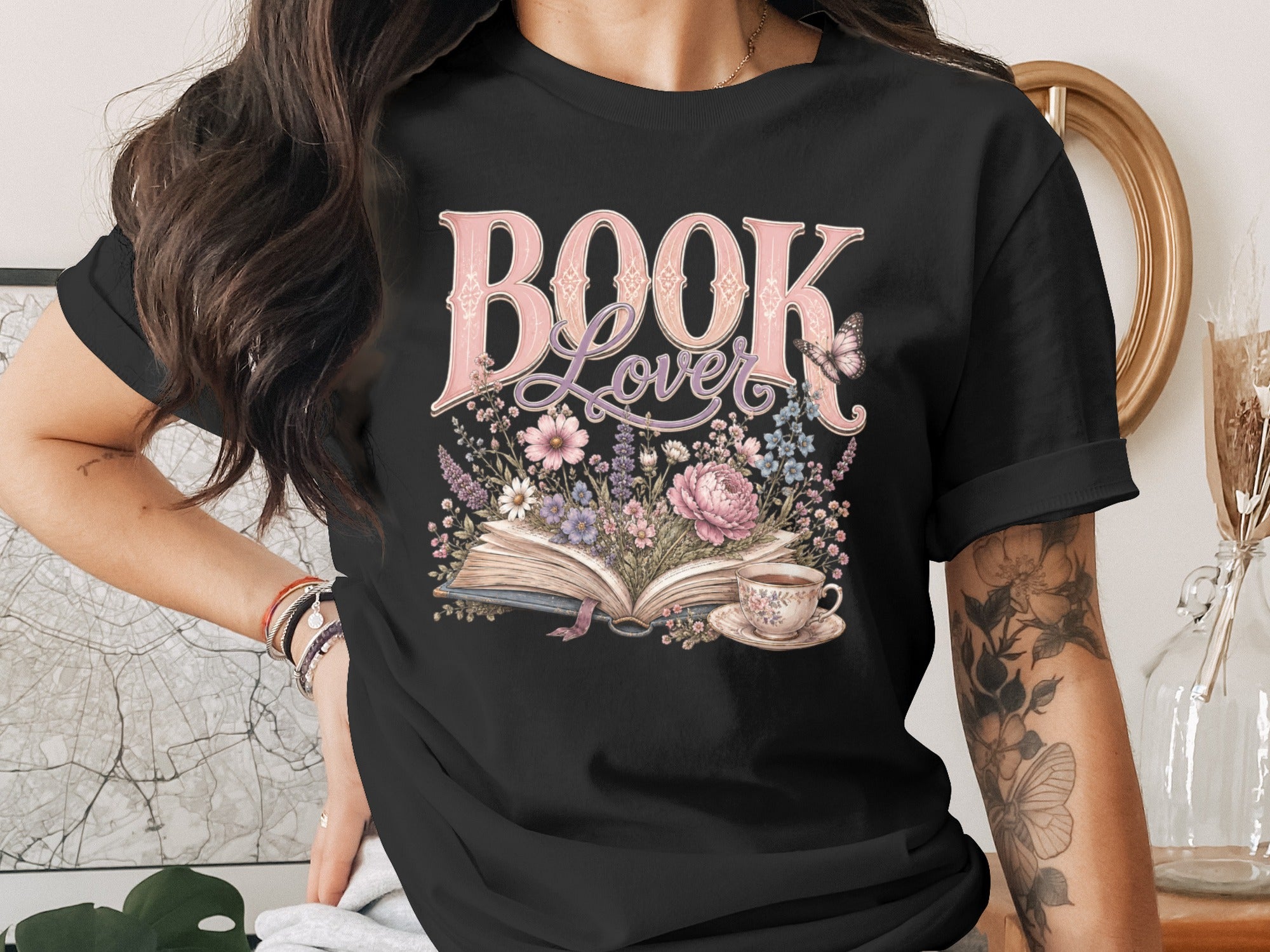 Black t-shirt with "Book Lover" text over an open book and flowers.