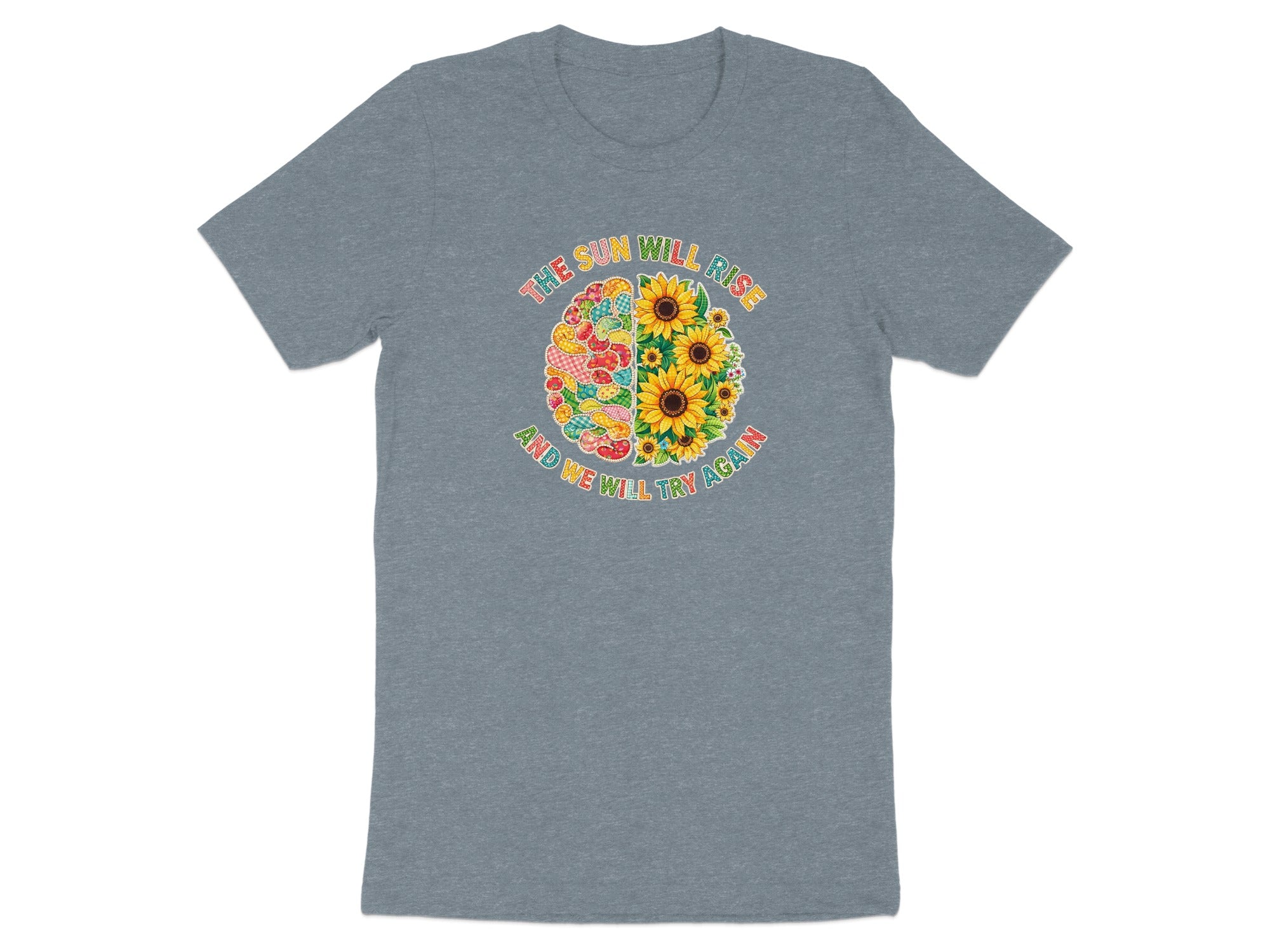 Gray t-shirt with "The sun will rise and we will try again" text and sunflower design.