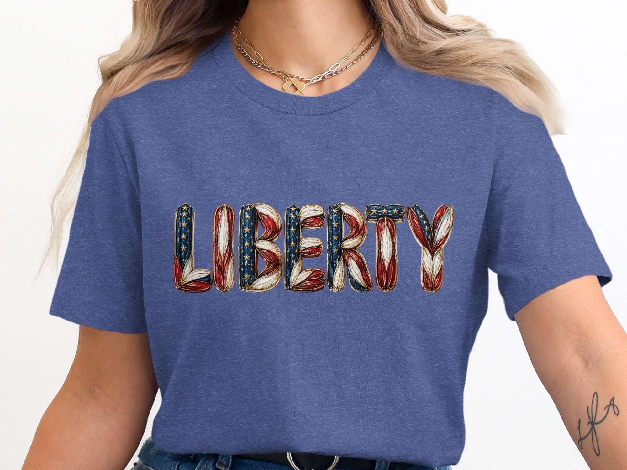 Blue t-shirt with "LIBERTY" text in patriotic flag design.