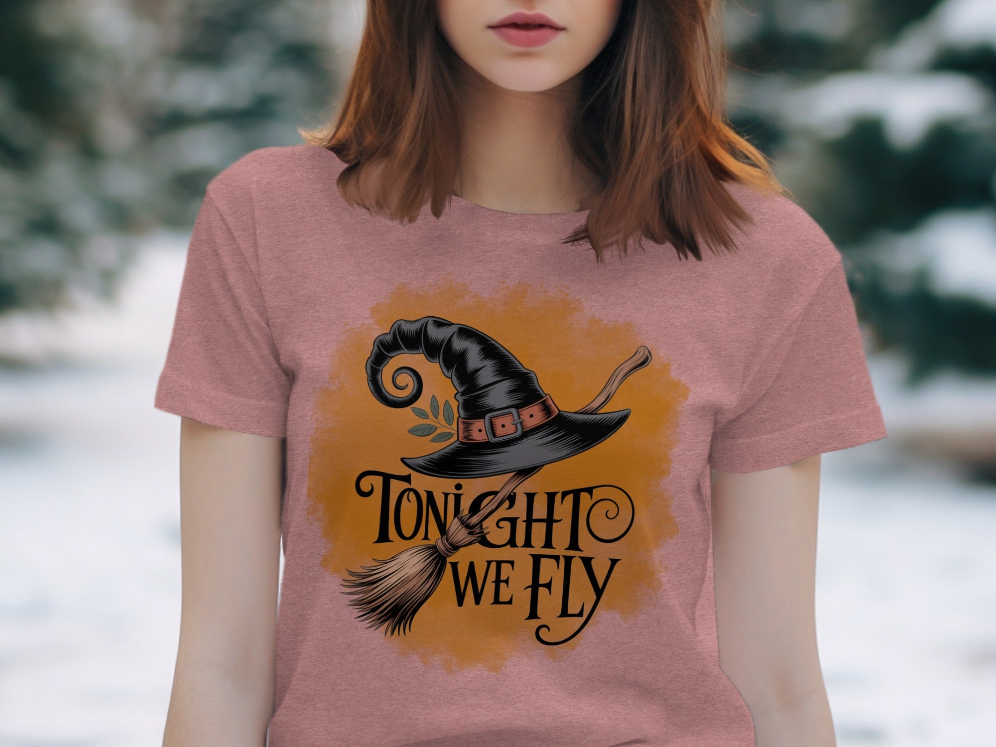 Pink t-shirt with witch hat, broomstick, and "Tonight We Fly" text.