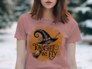 Pink t-shirt with witch hat, broomstick, and "Tonight We Fly" text.