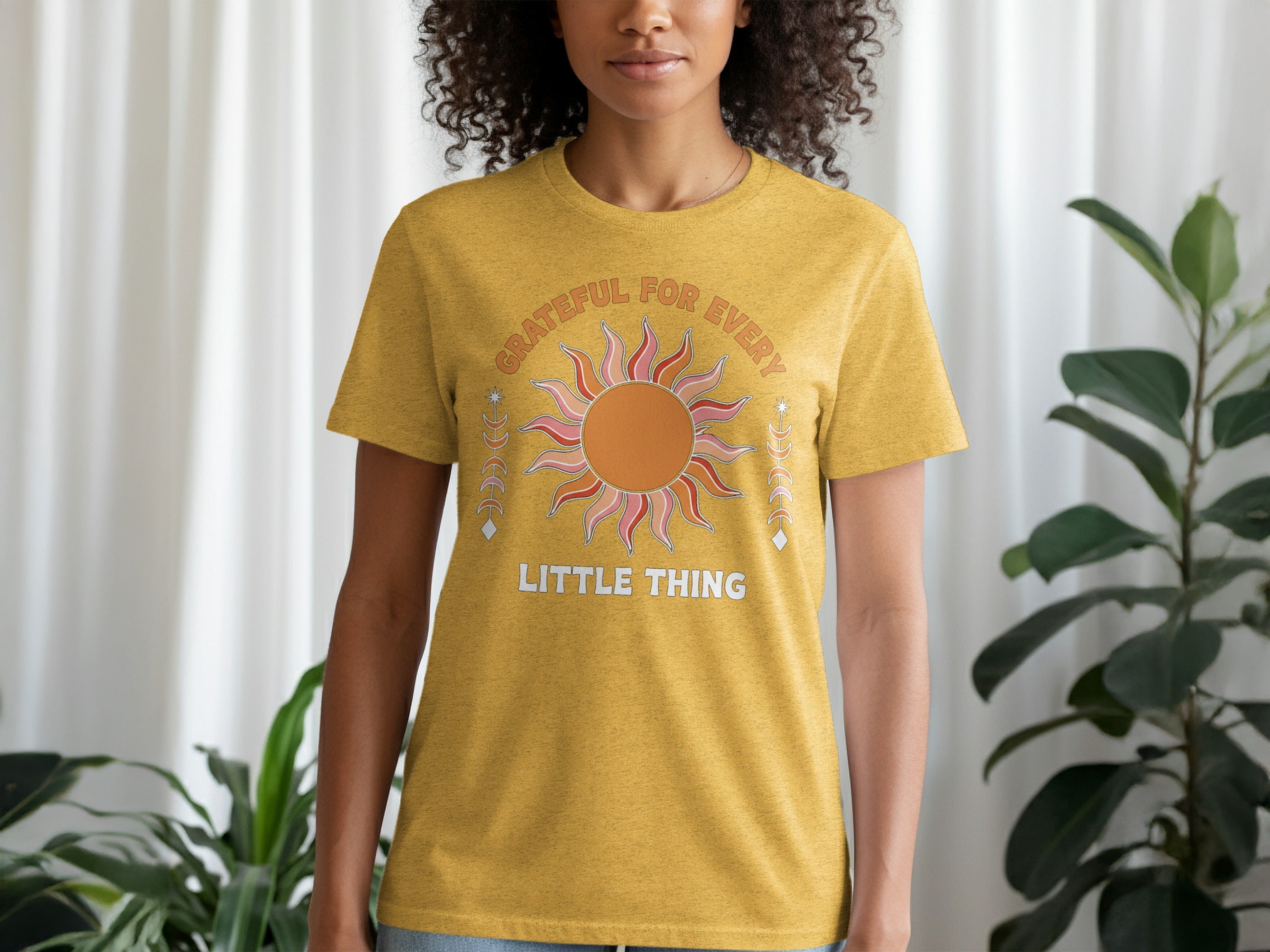 Yellow t-shirt with "GRATEFUL FOR EVERY LITTLE THING" text and graphic.