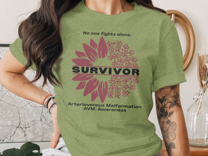 Olive green shirt with sunflower design supporting Arteriovenous Malformation awareness.