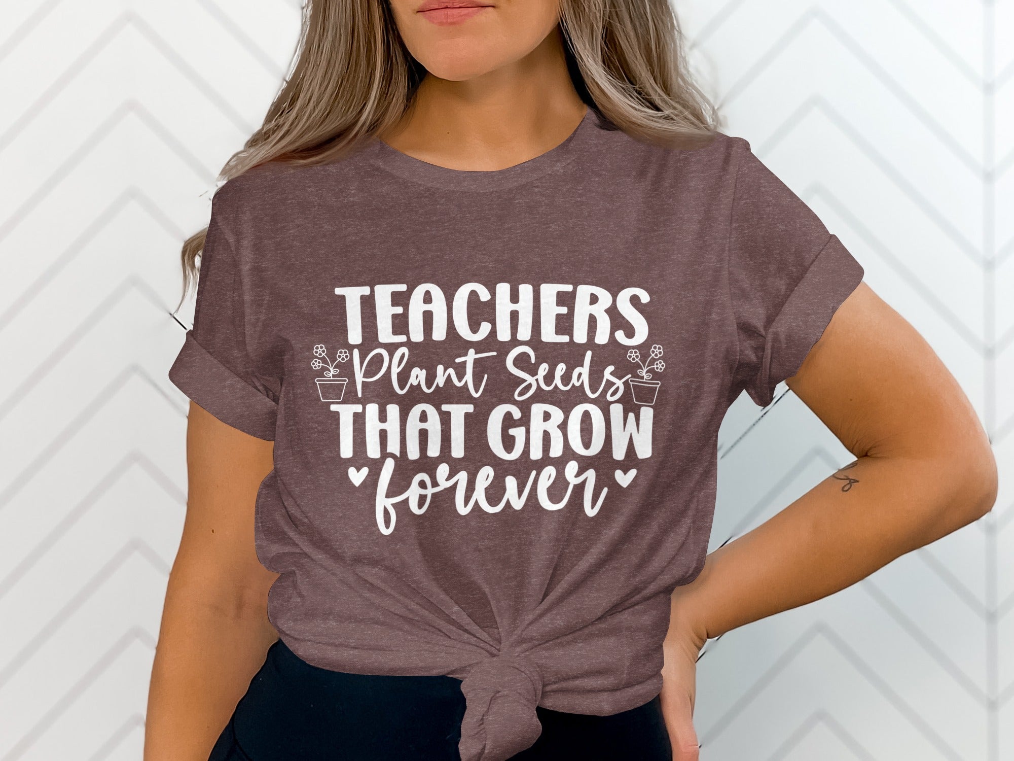 Brown t-shirt with white text: Teachers Plant Seeds That Grow Forever.