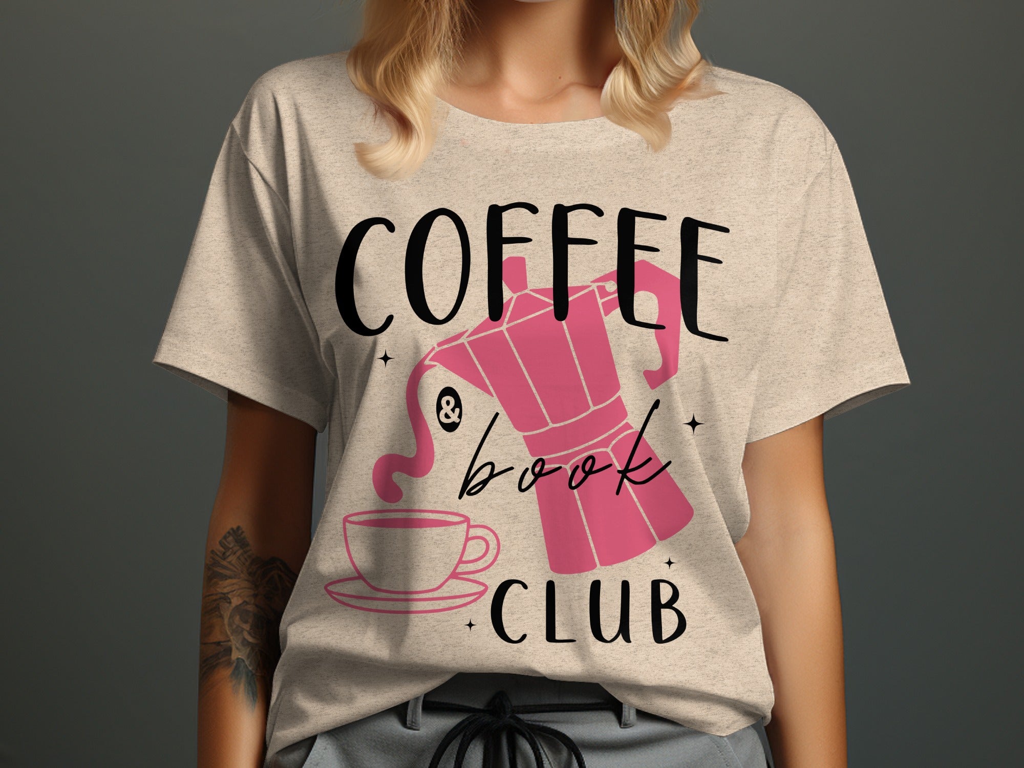 T-shirt with "Coffee & Book Club" text and a pink Moka pot and cup graphic