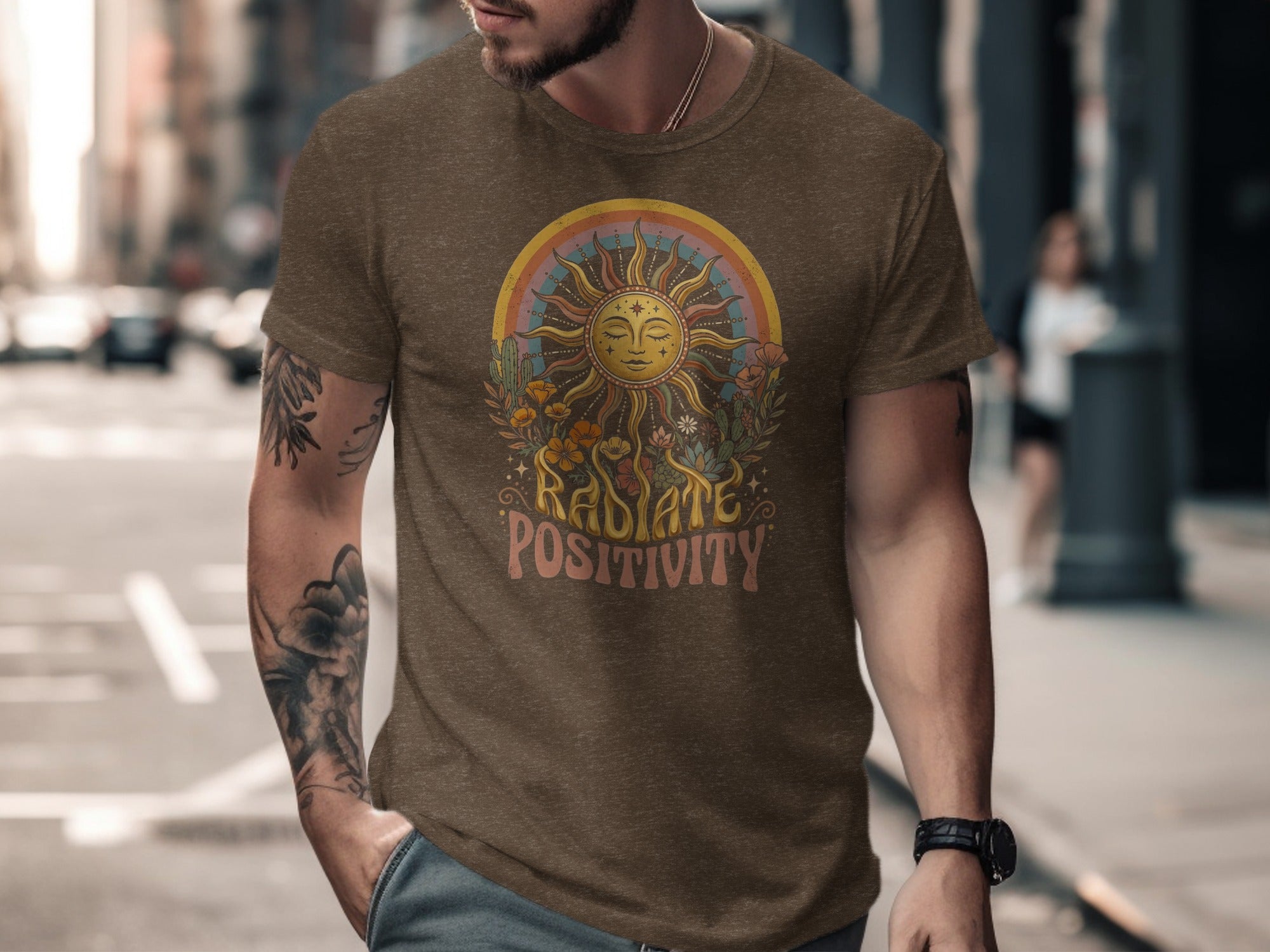 Brown t-shirt with sun, rainbow, flowers, and "Radiate Positivity" text graphic.