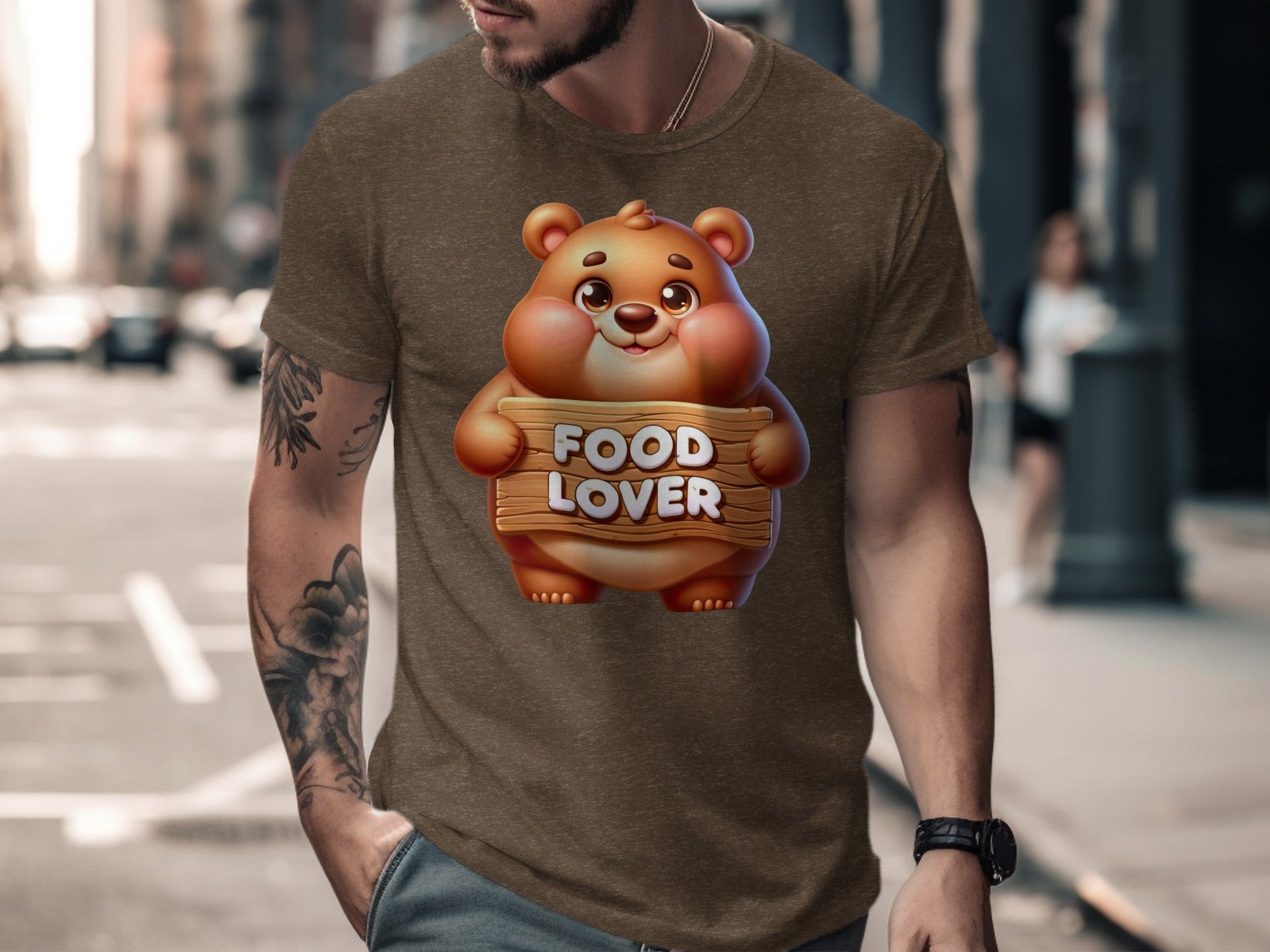 Brown t-shirt on man with cartoon bear holding "FOOD LOVER" sign.