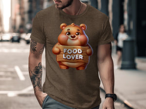 Brown t-shirt on man with cartoon bear holding "FOOD LOVER" sign.