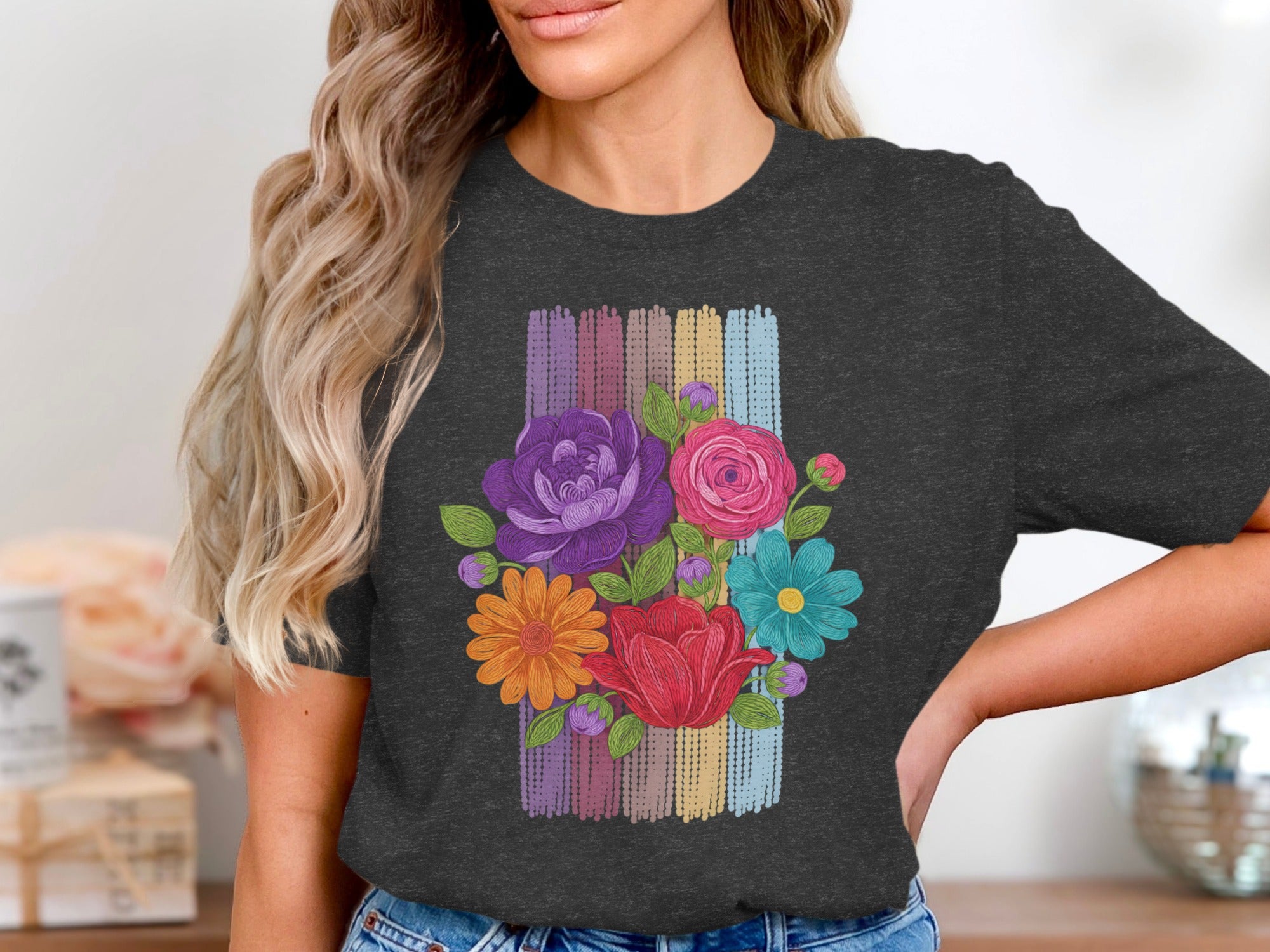 Dark grey t-shirt with a colorful floral bouquet graphic on a striped background.