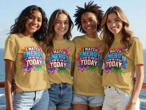 Four smiling women wear matching yellow shirts with the text "I MATCH ENERGY SO HOW WE GON' ACT TODAY".
