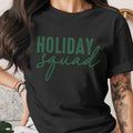 Black t-shirt with "HOLIDAY squad" text in green.