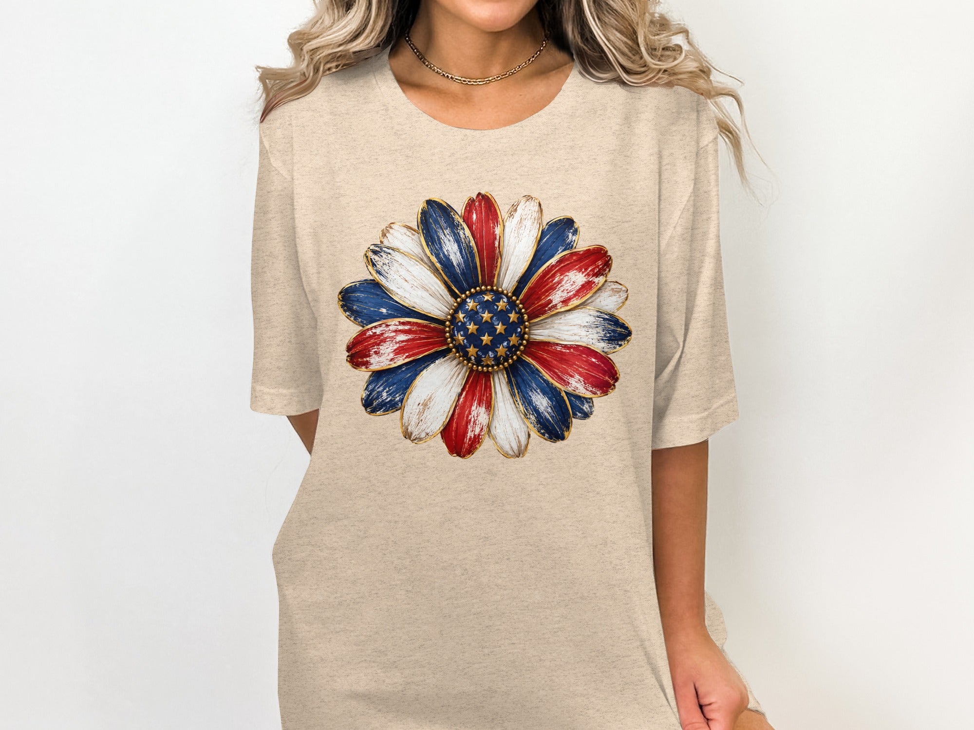 Beige t-shirt with a patriotic flower graphic featuring red, white, and blue petals.