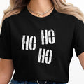 Black t-shirt with white "Ho Ho Ho" text in distressed block letters.
