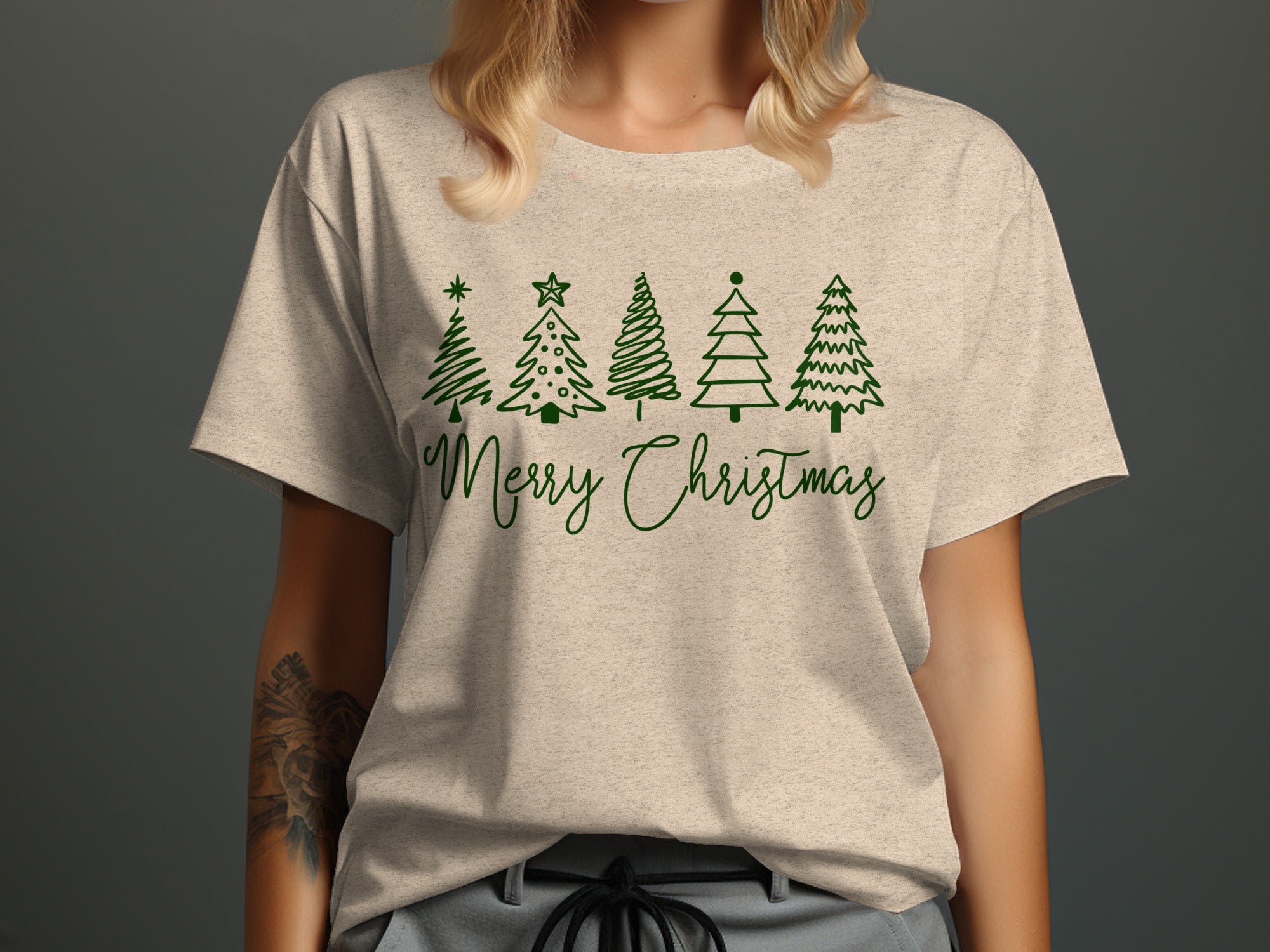 Light tan t-shirt with green Christmas trees and "Merry Christmas" text.