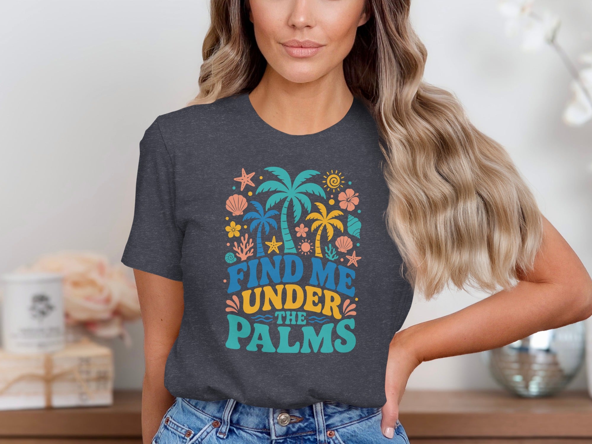 Dark grey t-shirt with the text "FIND ME UNDER THE PALMS" and tropical graphics.