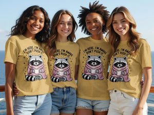 Four women smile wearing t-shirts with a raccoon holding coffee.