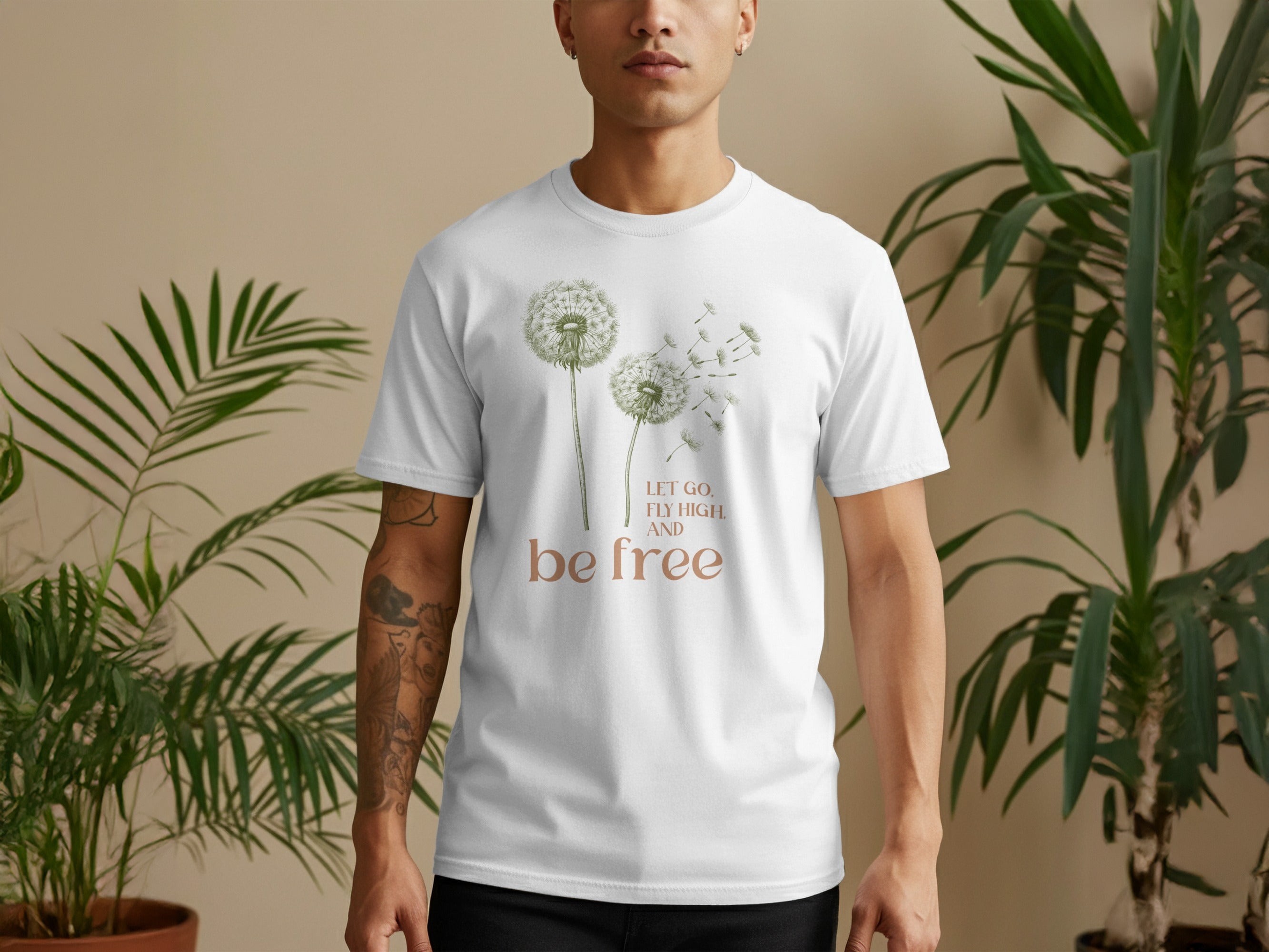 White t-shirt with dandelions and text "let go, fly high, and be free."