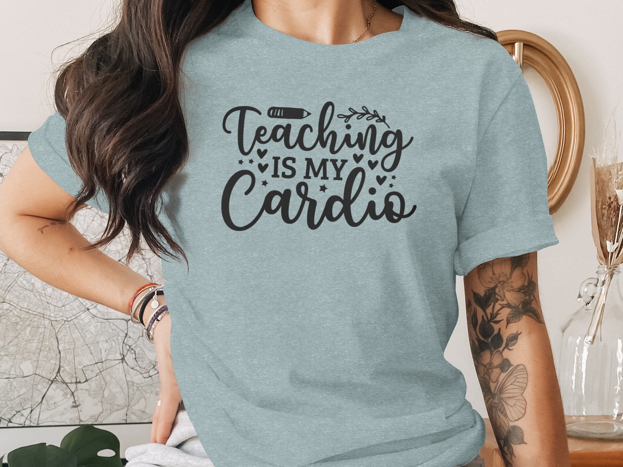 Light blue t-shirt with black script text that reads "Teaching Is My Cardio".