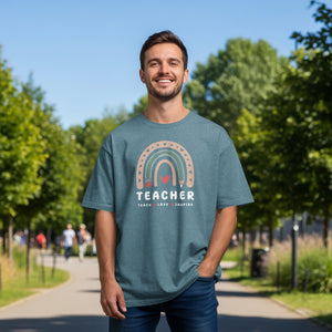Teal t-shirt with rainbow graphic and text: TEACHER TEACH LOVE INSPIRE.