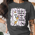 Ghost with pencil saying "You Can't Scare Me I'm A Teacher."