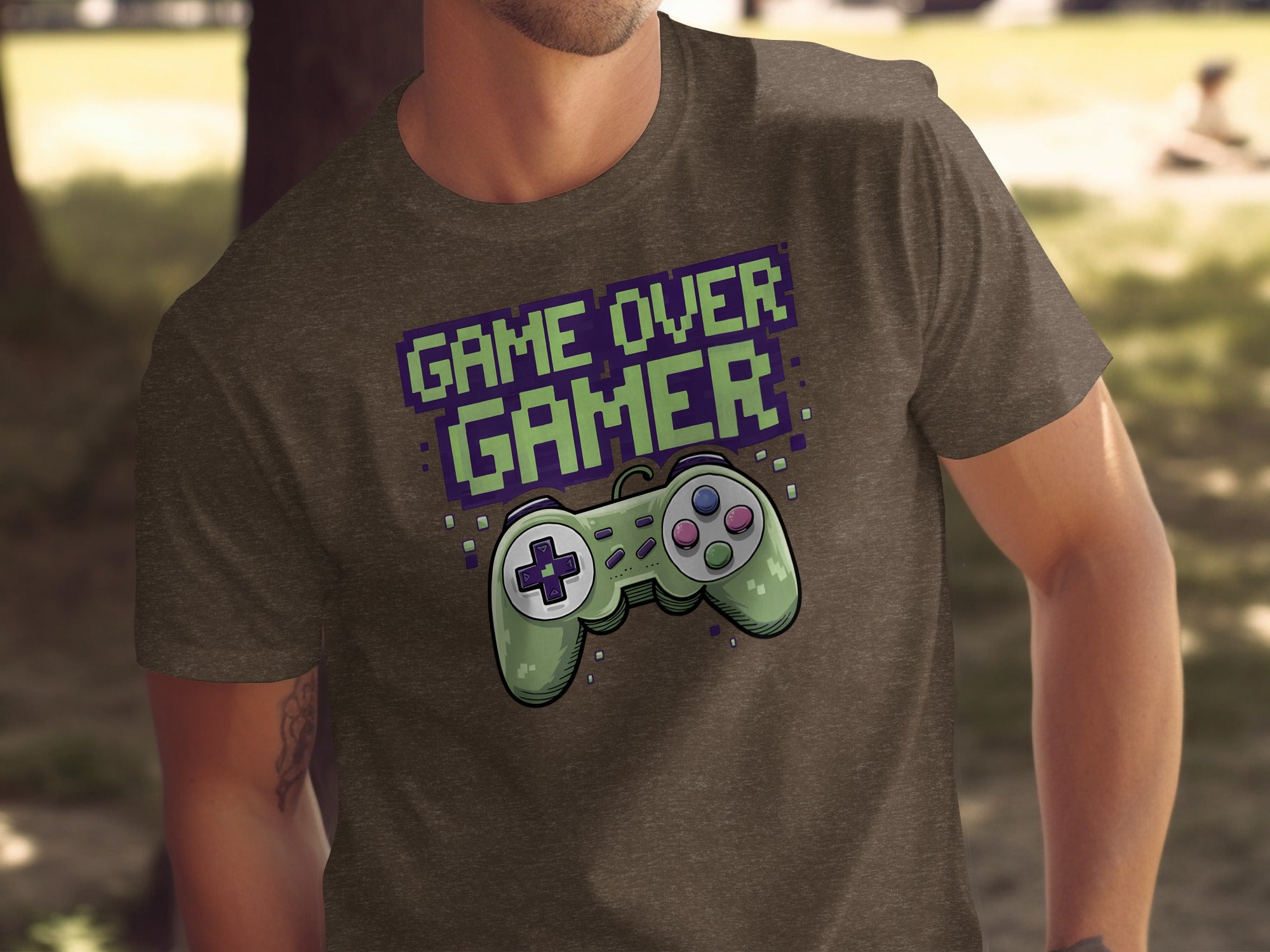 Brown t-shirt with pixelated "GAME OVER GAMER" text and a green controller.