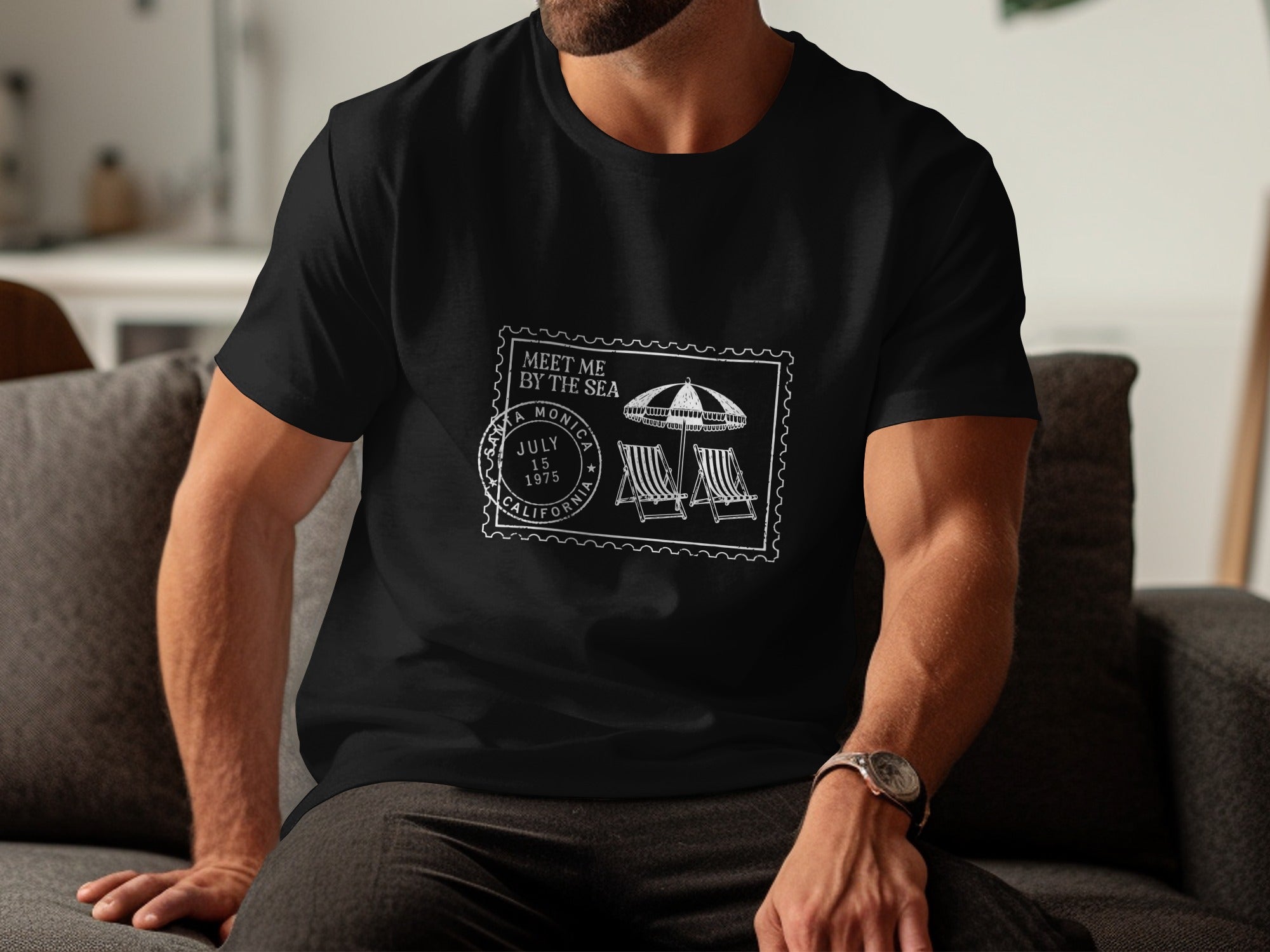 Black t-shirt with white stamp graphic: "Meet Me By The Sea", Santa Monica, July 15, 1975, California