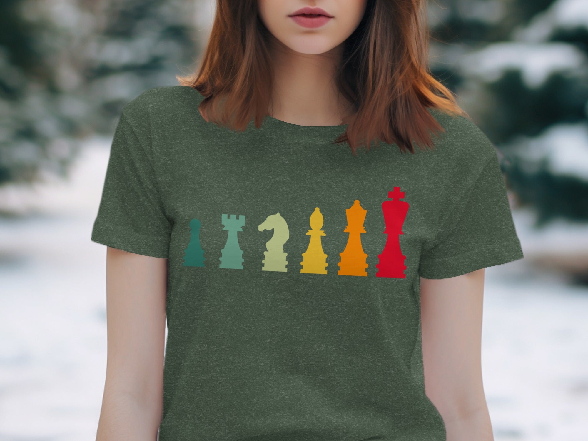 Green t-shirt with a row of colorful chess pieces in a vintage style.