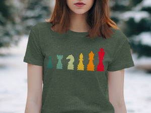 Green t-shirt with a row of colorful chess pieces in a vintage style.