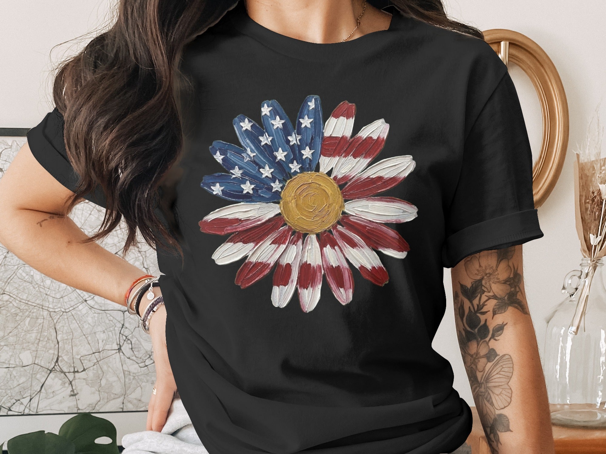 Black t-shirt with a flower graphic resembling the American flag