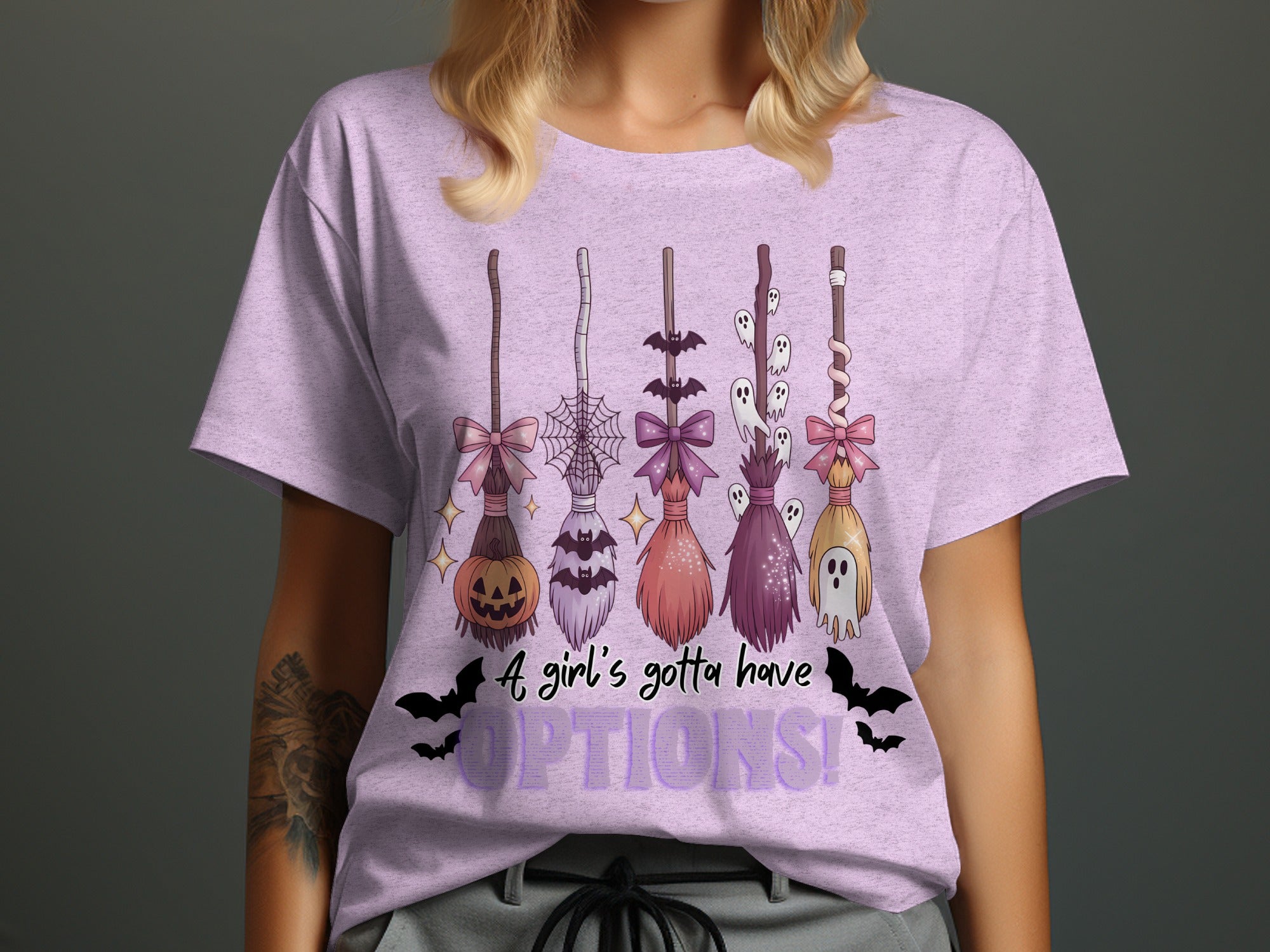 Witch brooms with Halloween motifs and text "A girl's gotta have OPTIONS!".