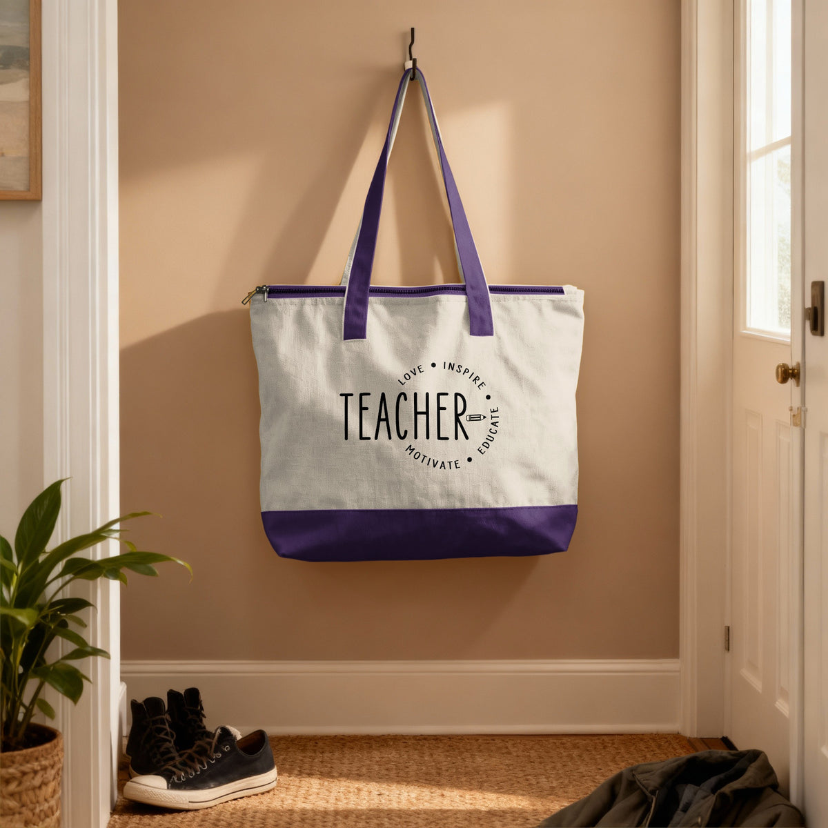 White canvas tote bag with purple trim and "Teacher" text with inspirational words.