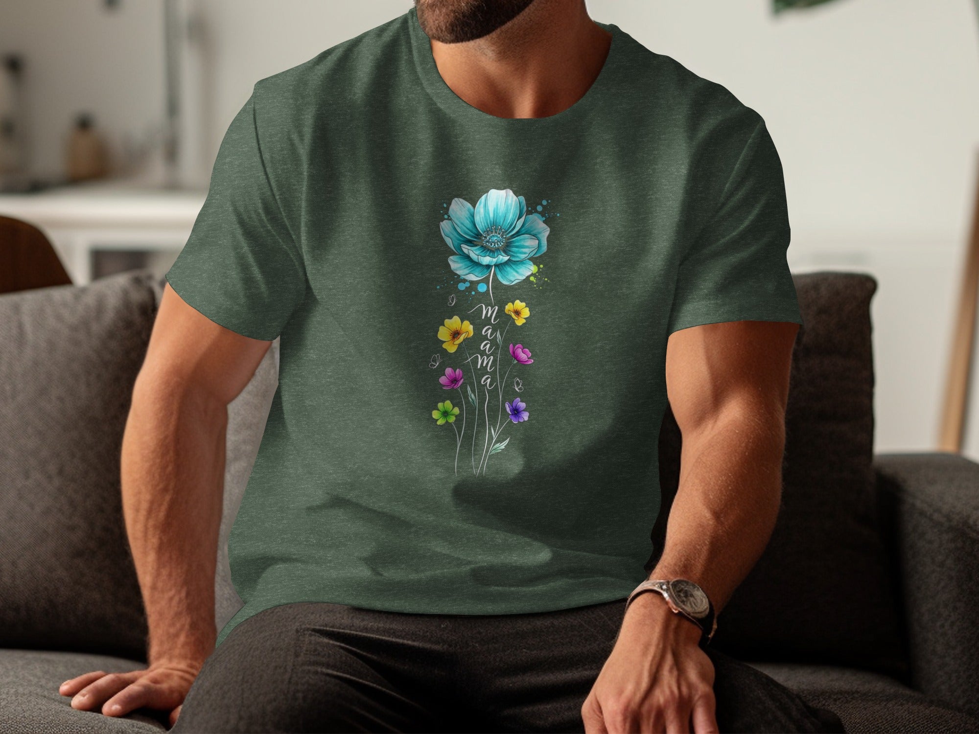 Green t-shirt with watercolor blue flower and "mama" text in cursive below.