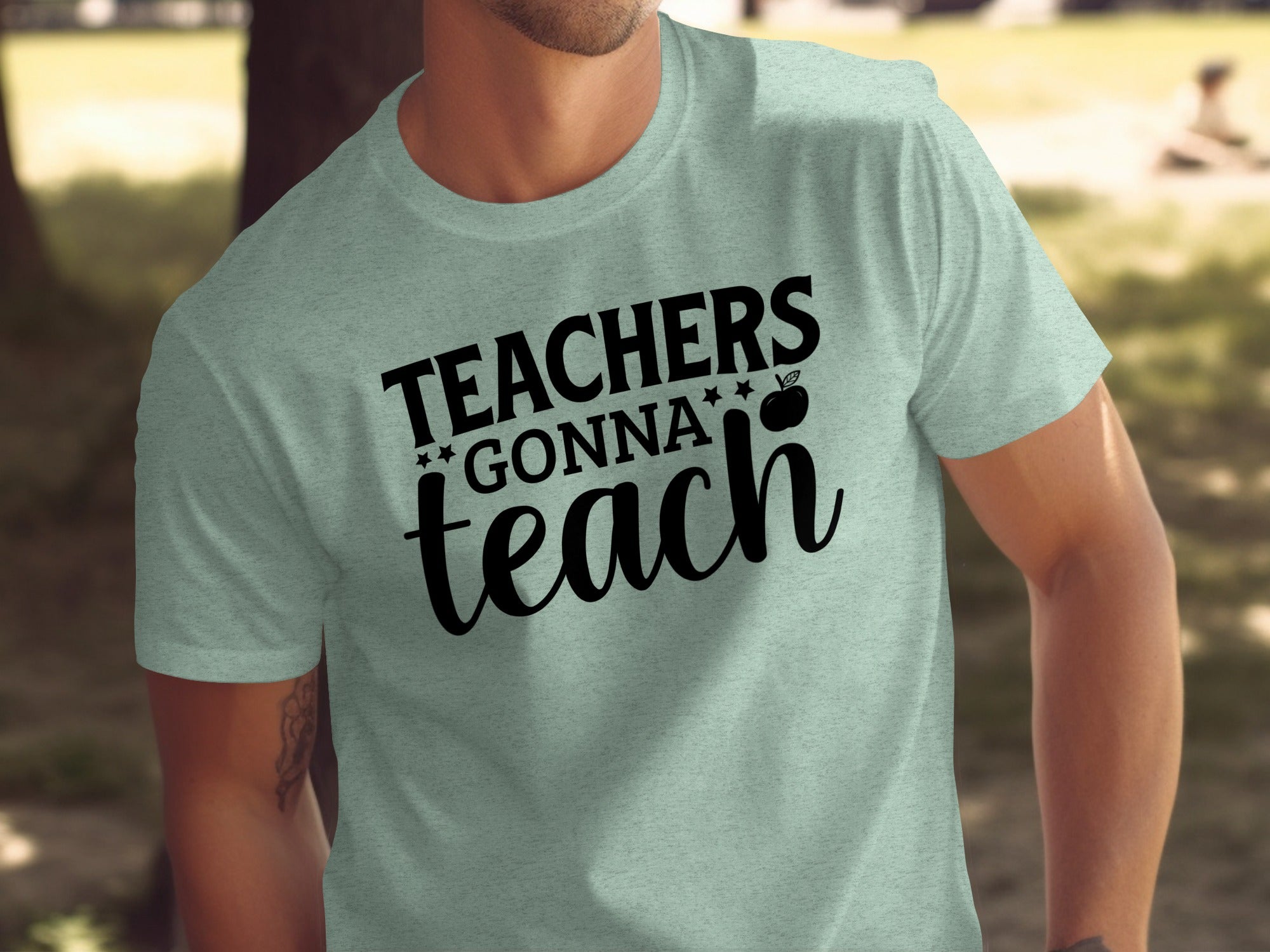 Light mint t-shirt with black text that reads "TEACHERS GONNA teach" and an apple graphic.