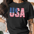 Black t-shirt with bold "USA" text in American flag design.