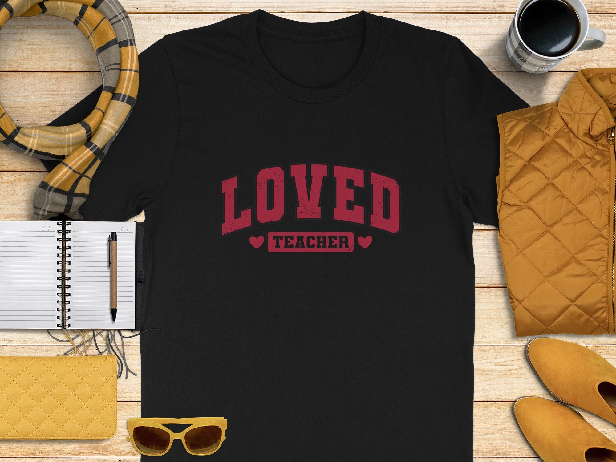 Black t-shirt with "Loved TEACHER" text and small hearts.