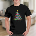 Black t-shirt with a colorful, abstract Christmas tree graphic and a yellow star.